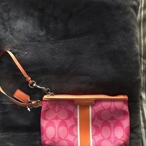 Small brand new Coach leather wristlet